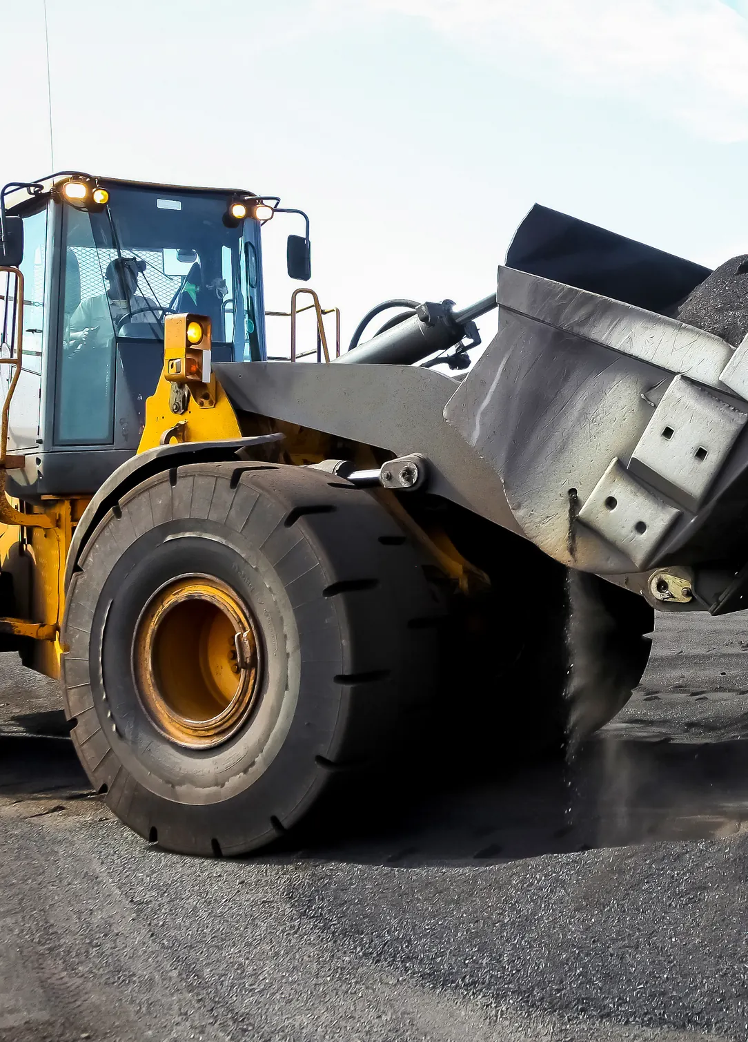 Front-end loader with its operator at a Barberry rail siding